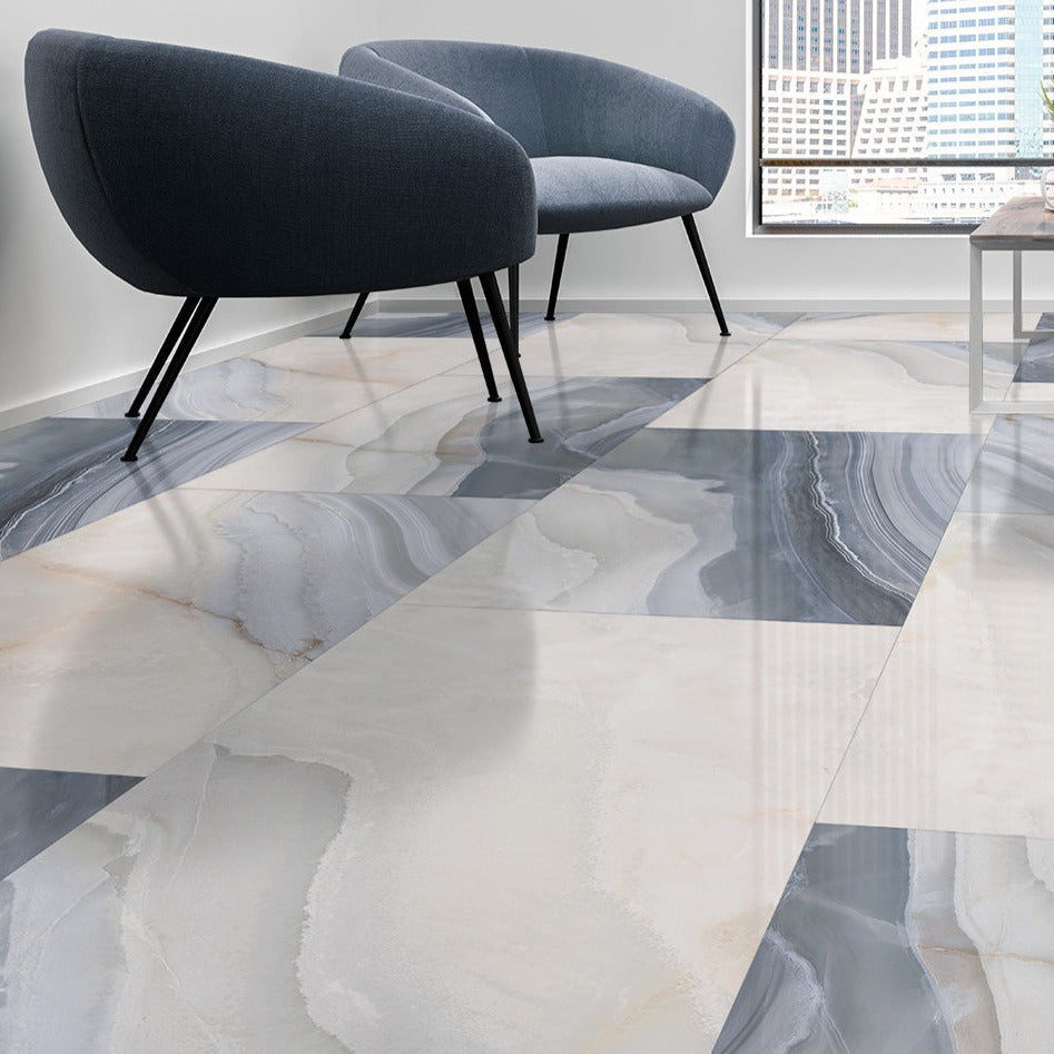 Agata Blue polished porcelain tile with a white marble design, for floors and walls. Made in Italy, installed in a room.