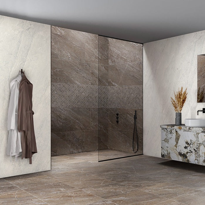 Agathos Multicolor matte porcelain tile with a stone design, for floors and walls. Made in Italy, installed in a room.