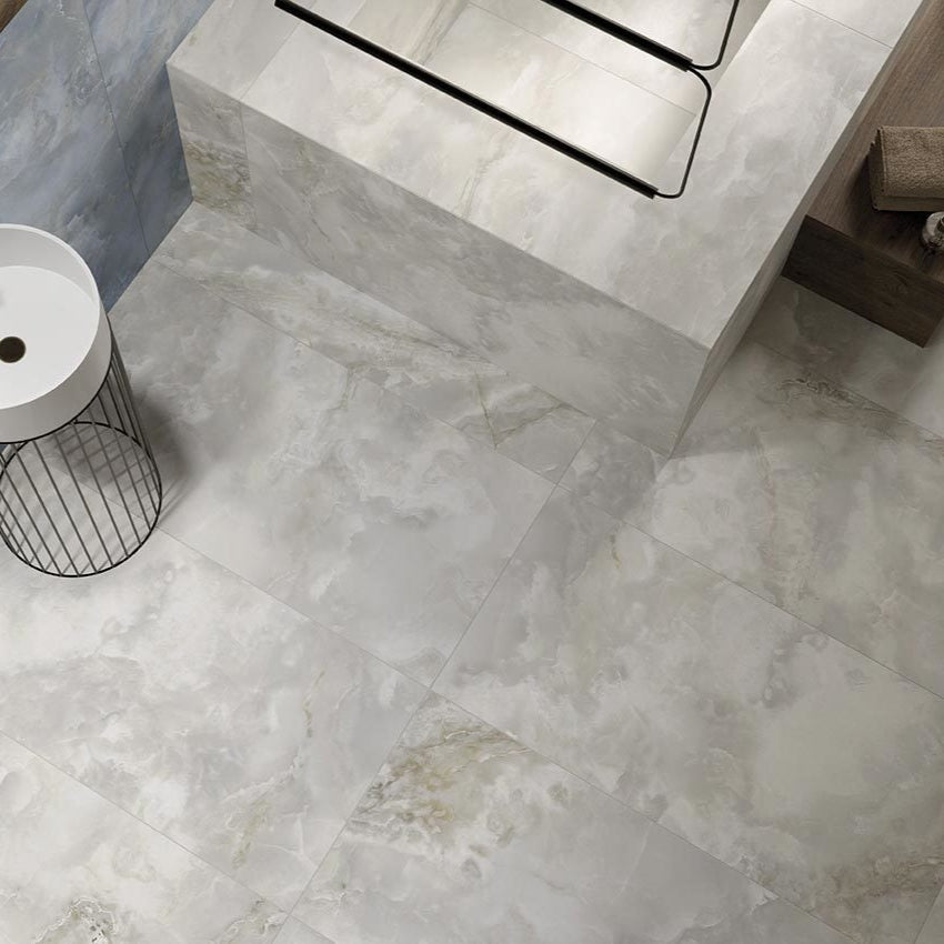 Onyx White matte porcelain tile with a natural onyx design, for floors and walls. Made in Italy, installed in a room.