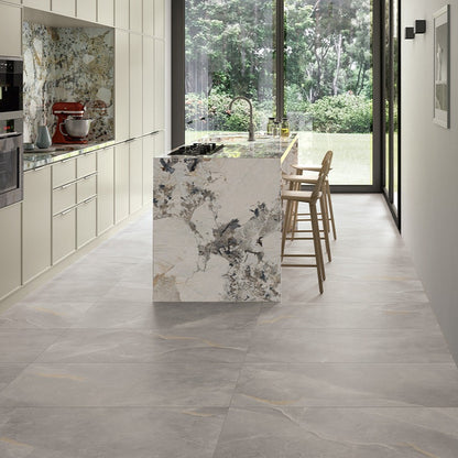 Spark Grey matte porcelain tile with a stone design, for floors and walls. Made in Italy, installed in a room.