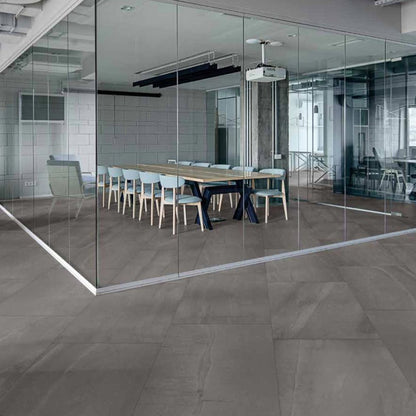 Stone Collection Dark Grey stone look matte porcelain tile for floor and wall made in Italy. Installed in room.