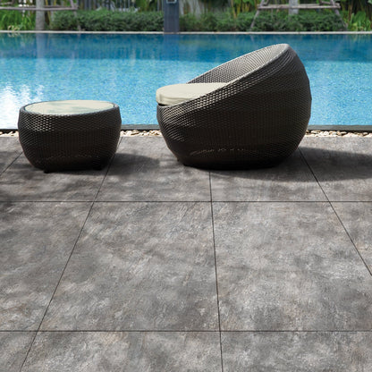 Urano Grigio matte porcelain tile with a grey stone design, for floors and walls. Made in Italy, installed outside.