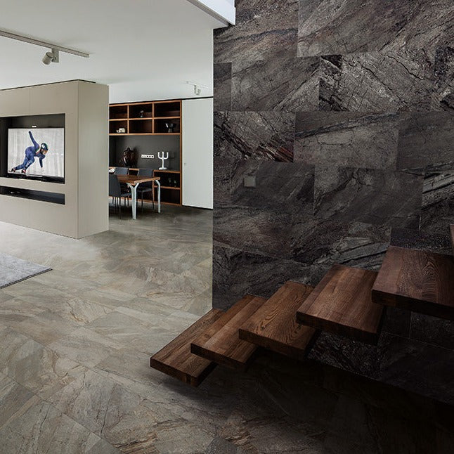 Utah Slate matte porcelain tile with a black stone design, for floors and walls. Made in Italy, installed in a room.